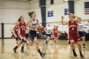Maddie Hallowell of North Haven drives to the hoop against Vinalhaven.