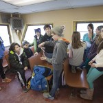 Younger mainland students gather in the passenger area of the ferry.