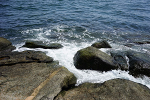 ocean waves lapping at rocks