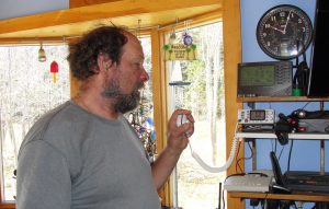 Clayton Philbrook demonstrates using his VHF radio on Matinicus Island.