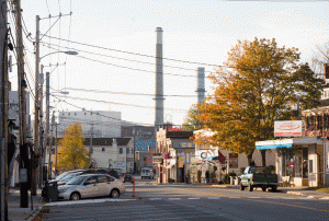 A view down Bucksport's Main Street, with the paper mill's smokestacks in view.