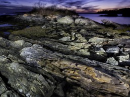 coastal rocks photographed at dusk
