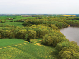 Aerial photo of farm fields and a river.